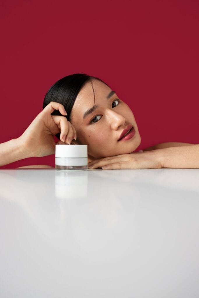 medium shot korean woman posing with face cream AR0MGbLOq6s4LL00