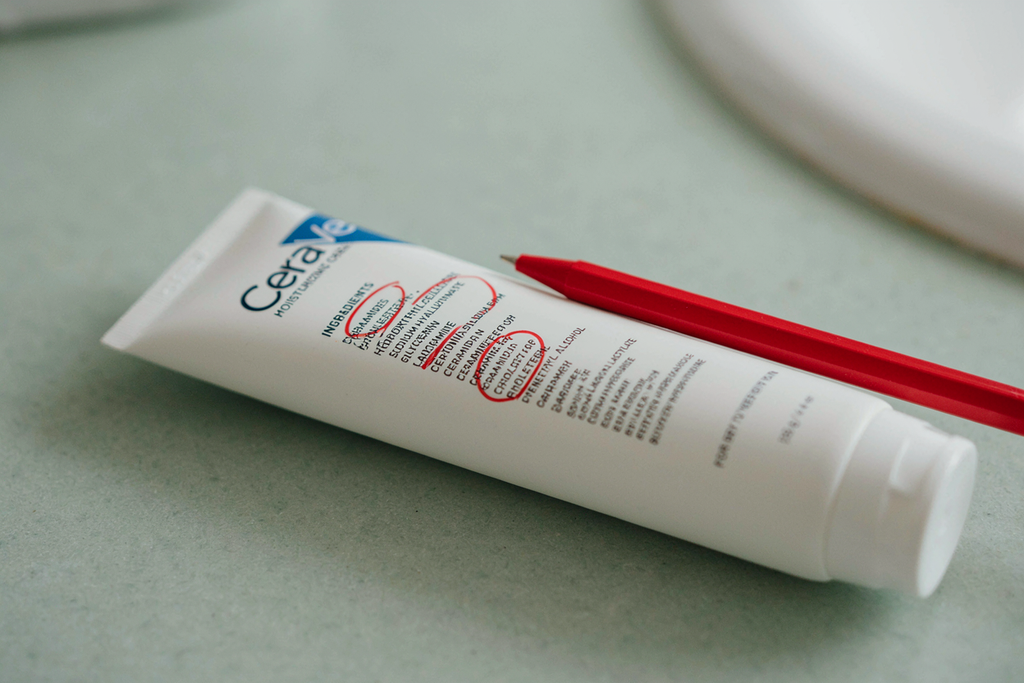 close-up of a CeraVe ingredient label with ceramides/cholesterol circled or highlighted.